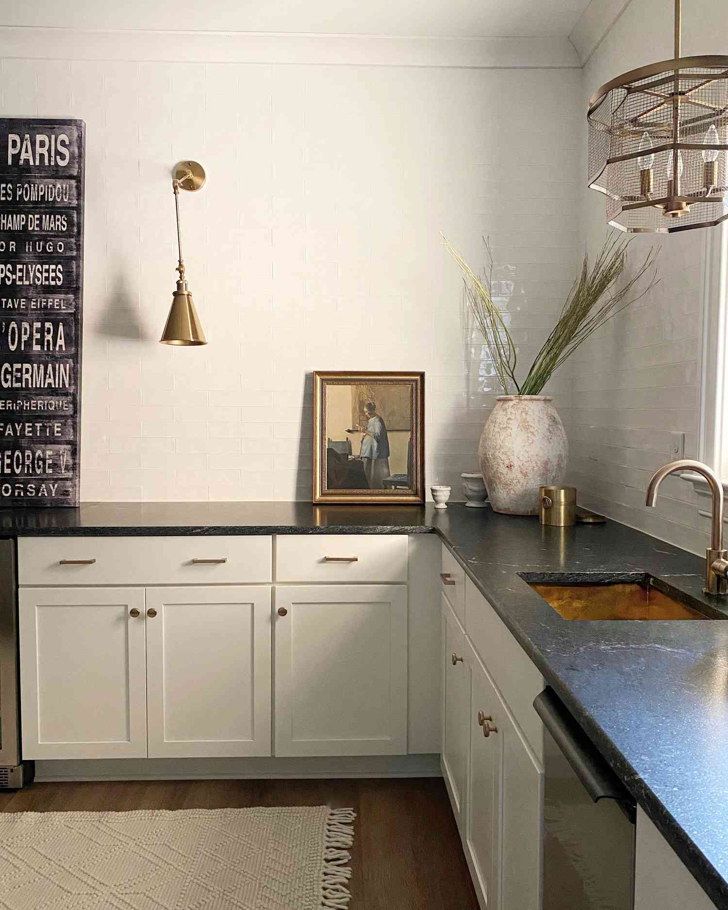 off-white cabinets with black countertops