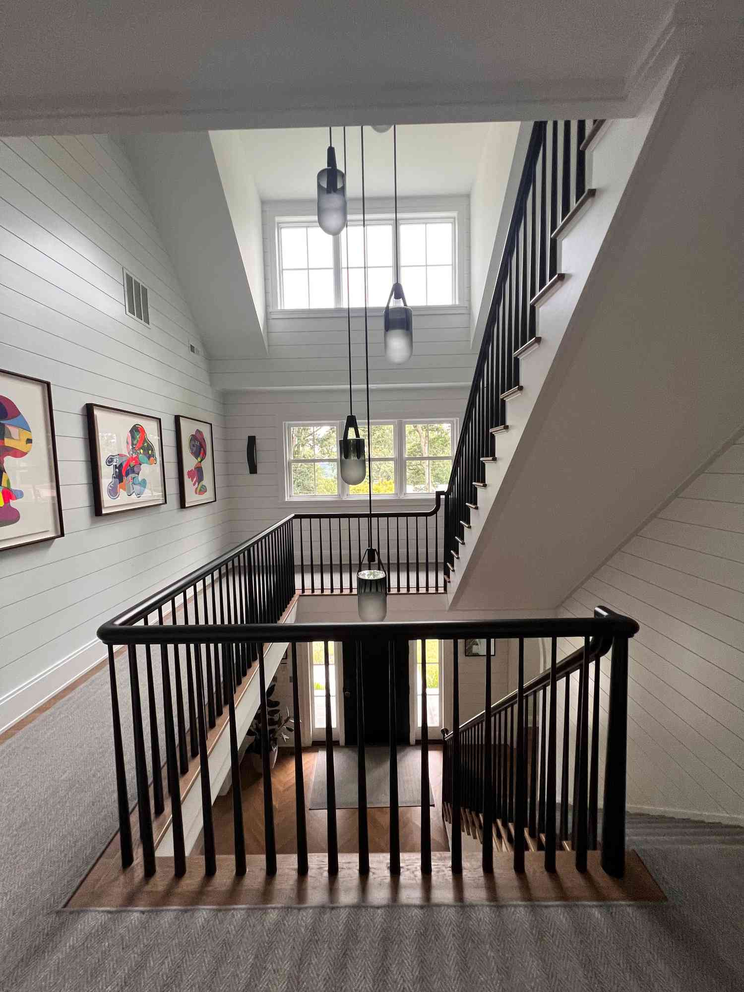 Large entryway with drop lighting clusters.