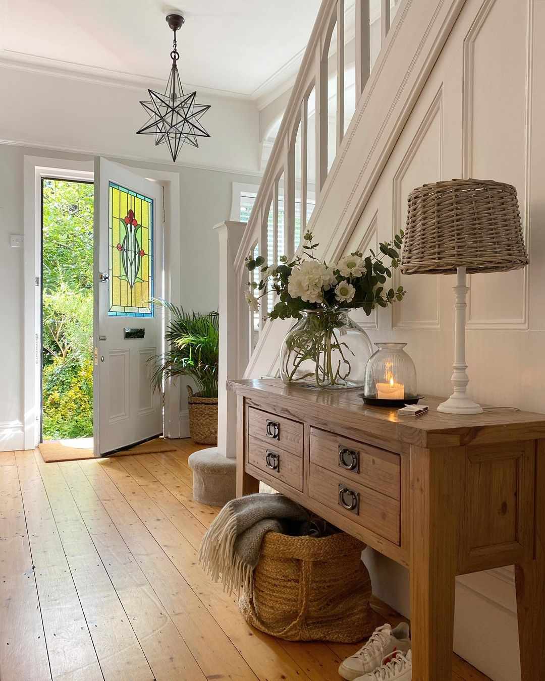 Entryway with bold geometric pendant.