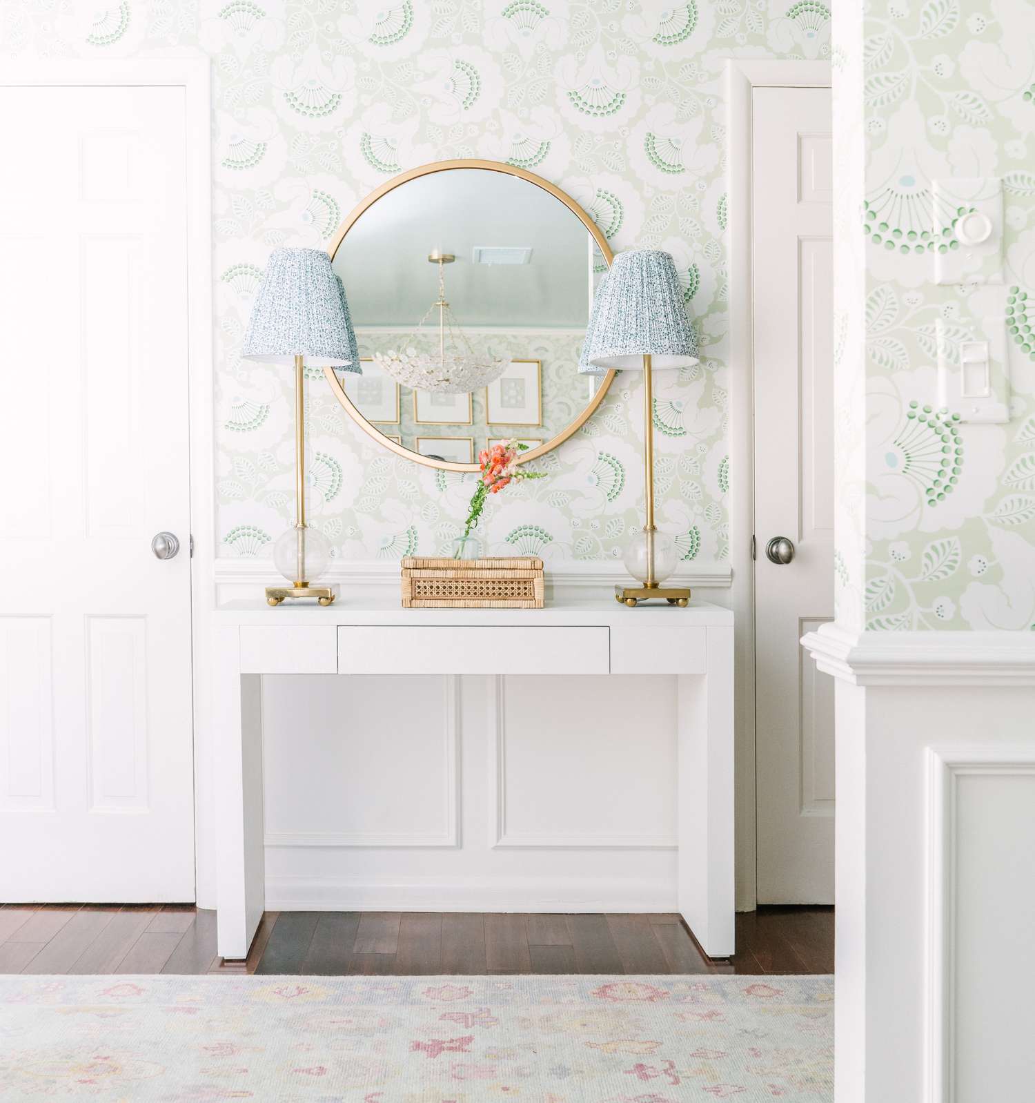 Bright entryway with symmetrical table lamps.