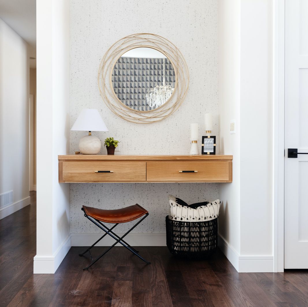 Entryway nook with a small table lamp.