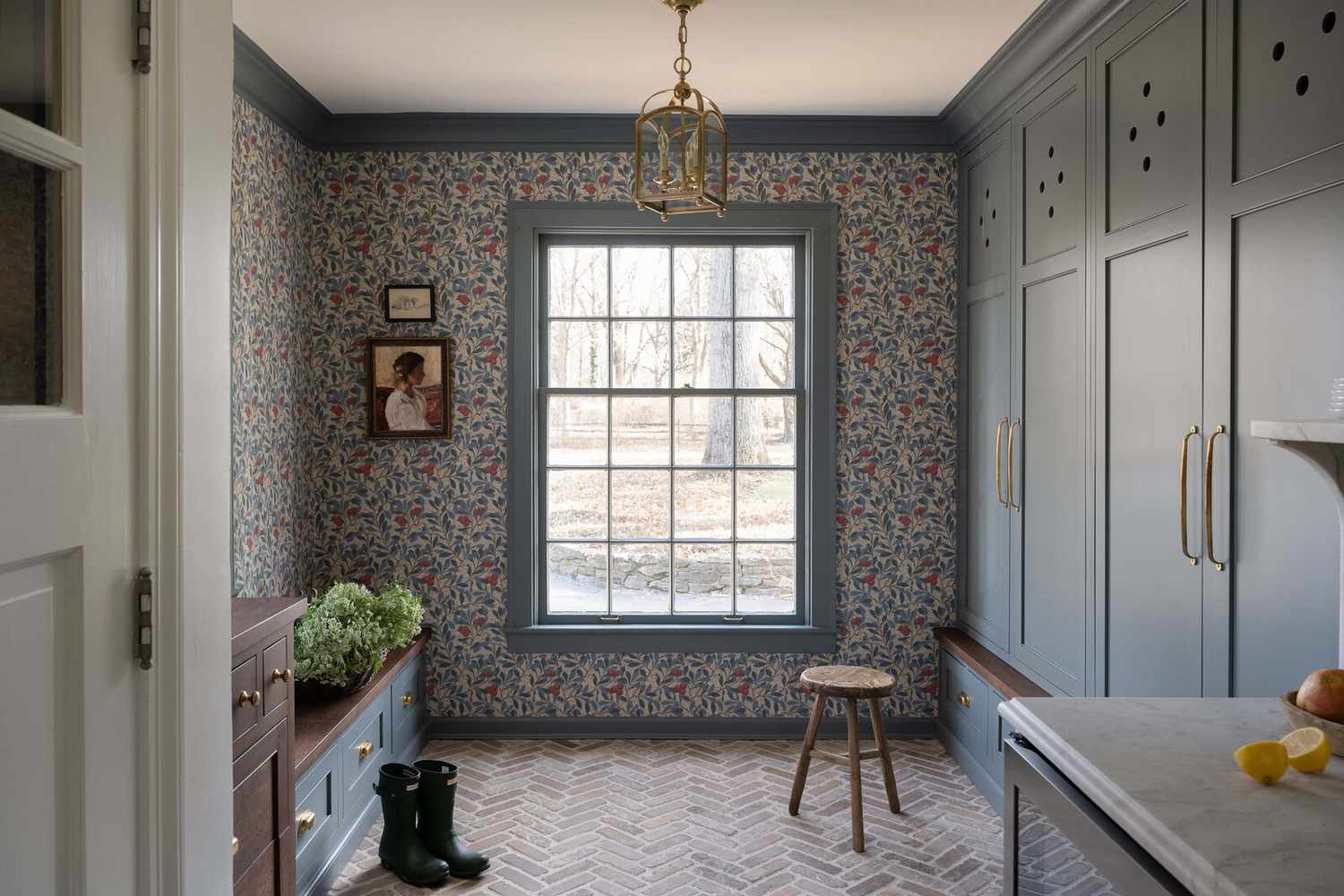 Entryway mudroom with a hanging lantern fixture.