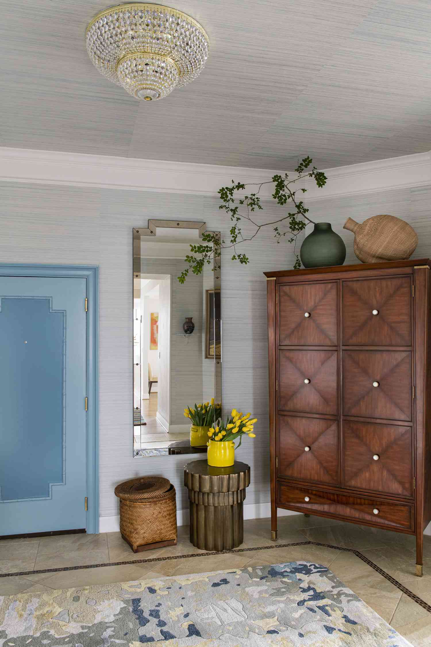 Entryway with crystal pendant light.