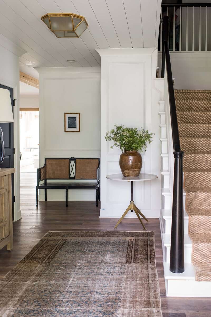 Entryway with vintage-inspired flush mount light.