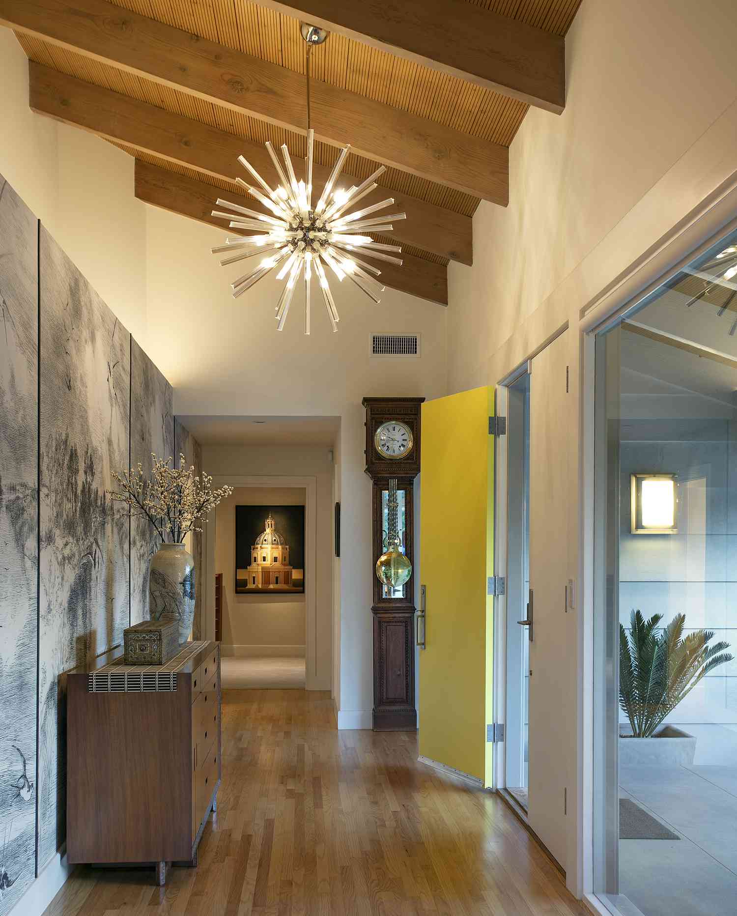 Entryway with sputnik sphere chandelier.