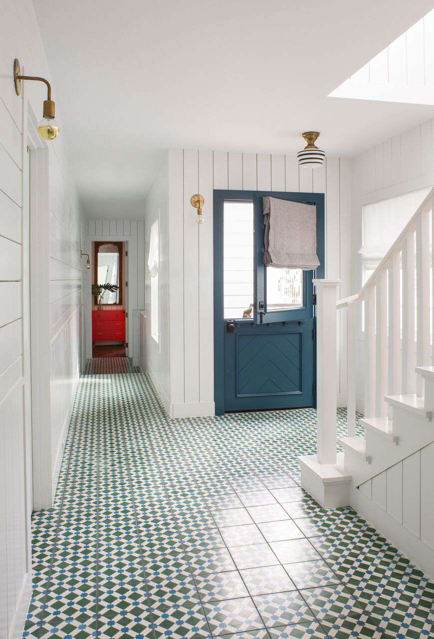 Entryway with gold light fixtures.