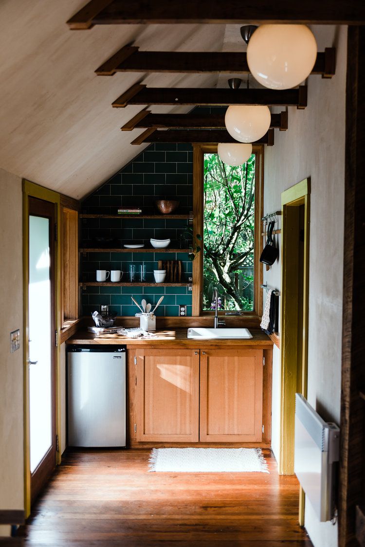 small kitchen with half-vaulted ceiling