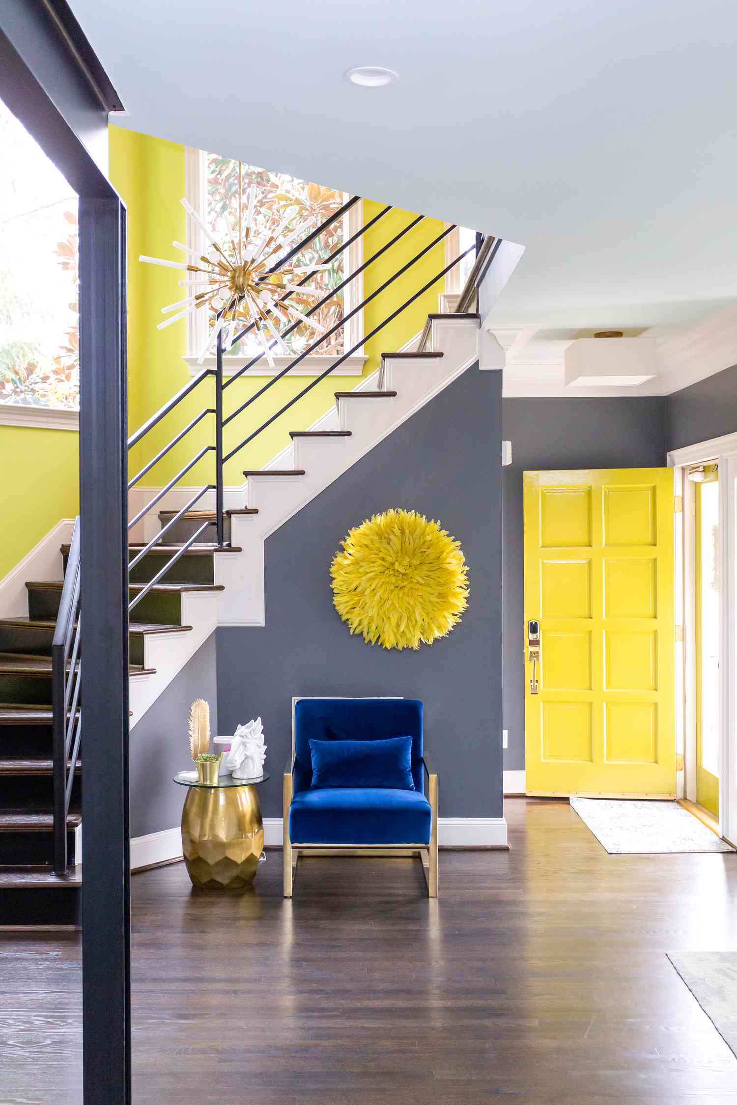 A gray entryway wall is decorated with 3D artwork that resembles a giant puff ball.