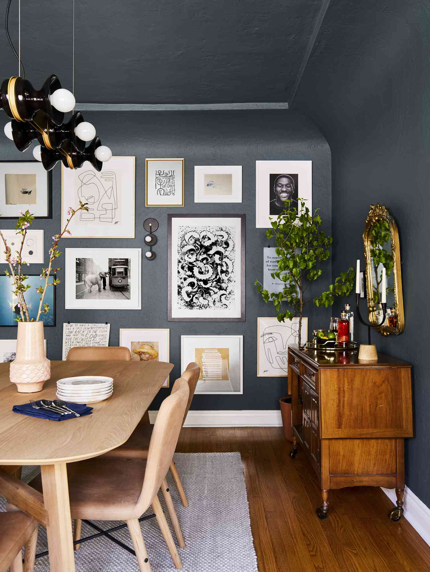 gallery wall in black dining room