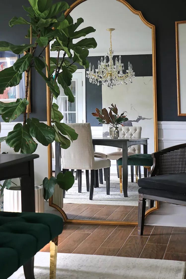 black dining room with chandelier 