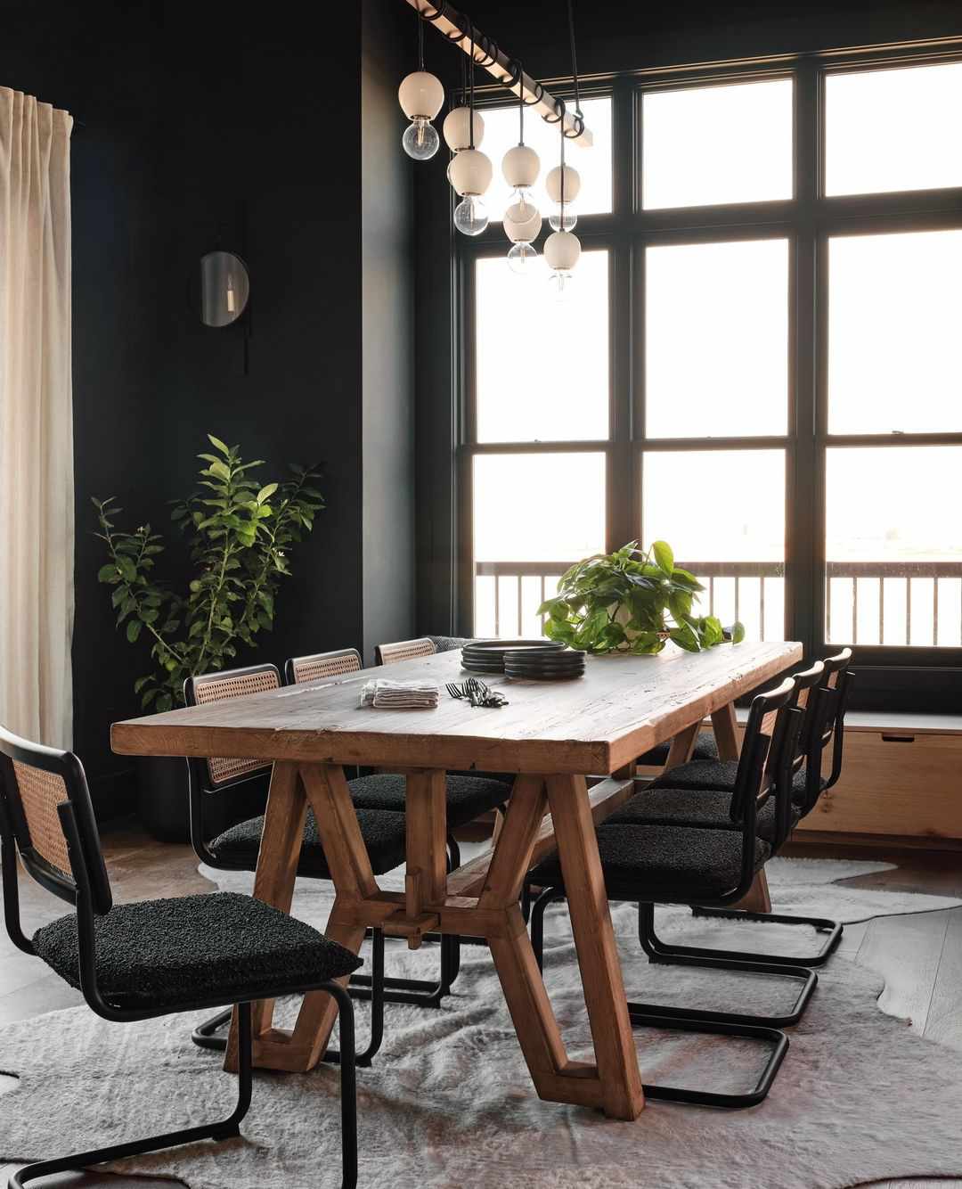 black dining room with wood table