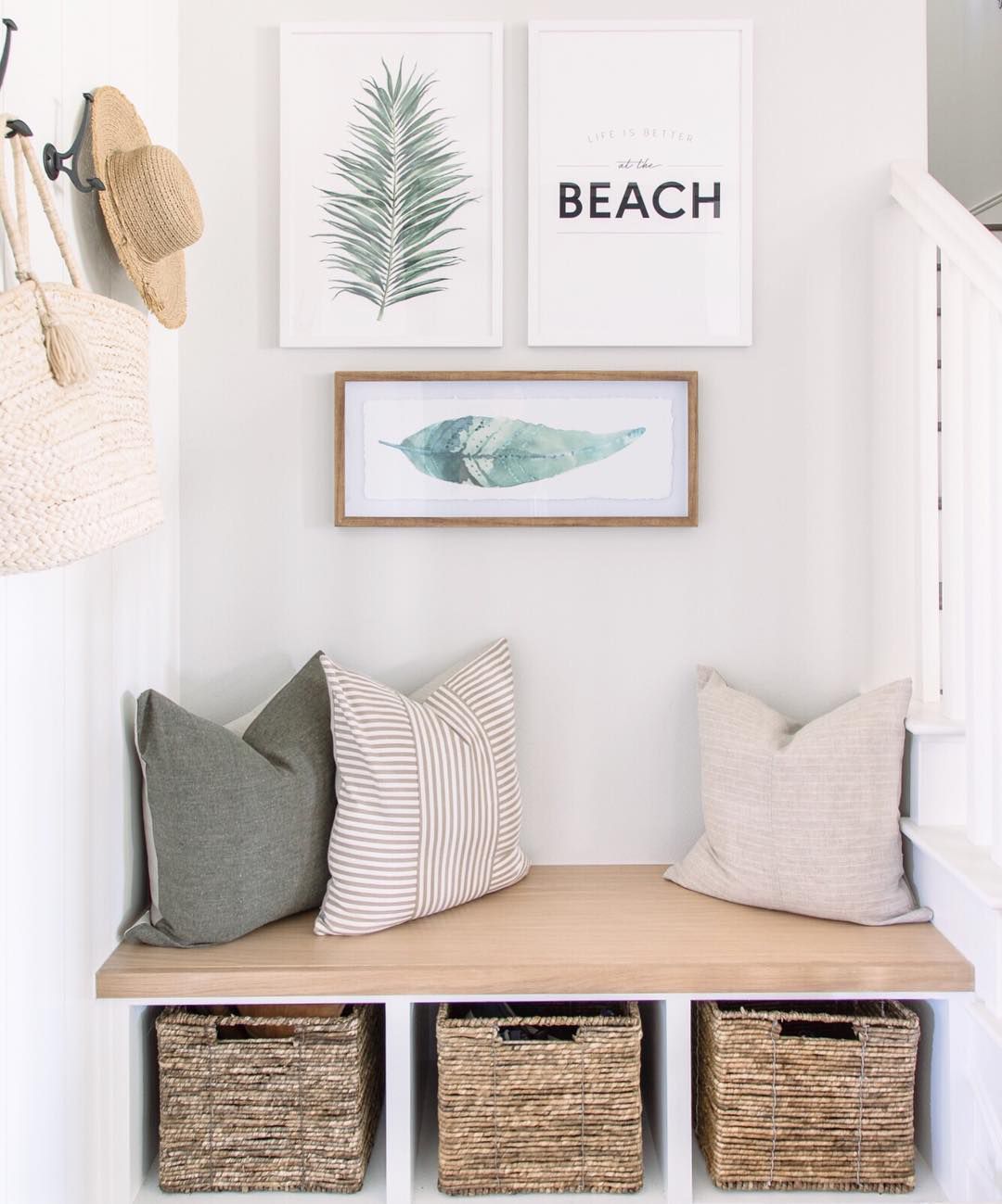 A mudroom nook with baskets for storing shoes