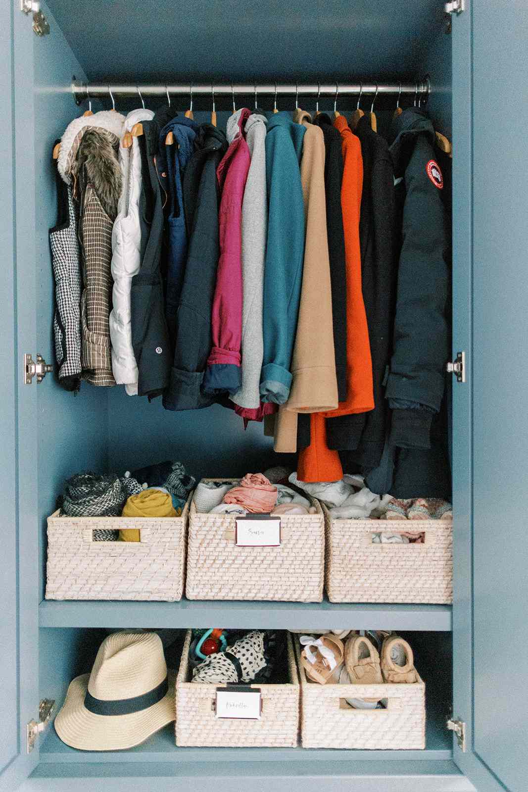 A closet with organizational baskets