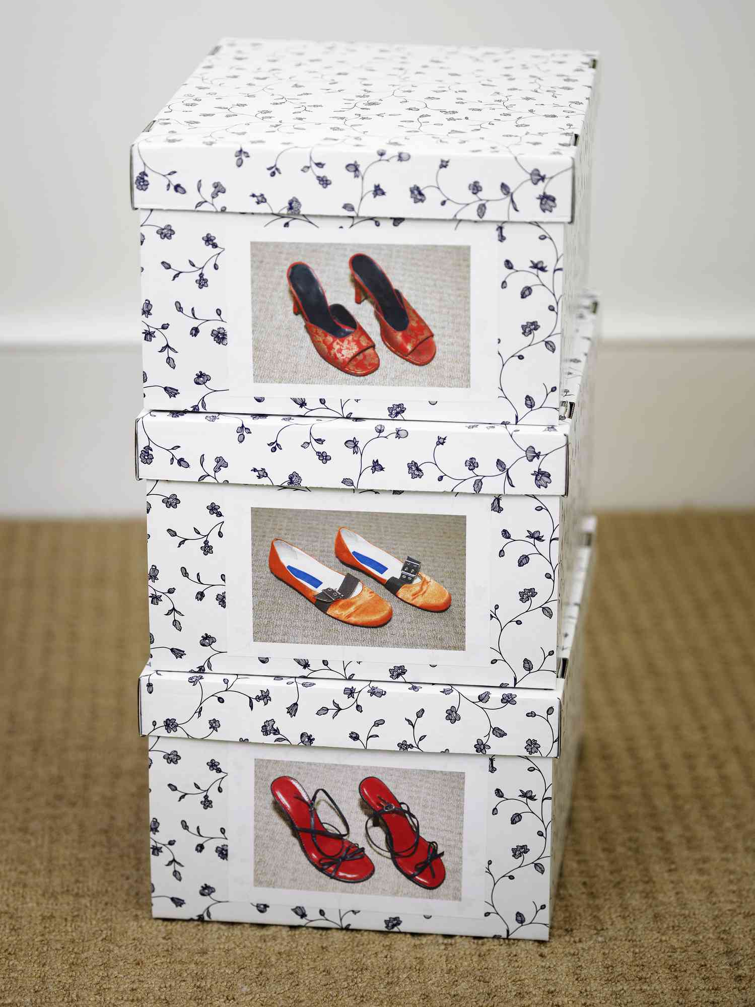 Shoeboxes with pictures of the shoes inside