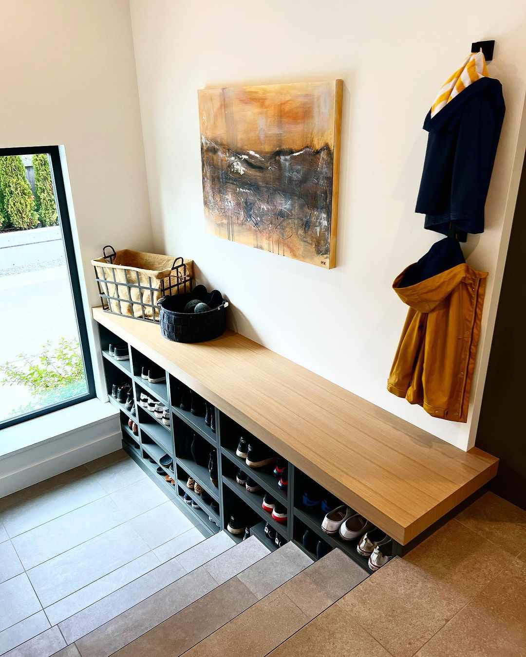 A custom built shoe shelf by a staircase