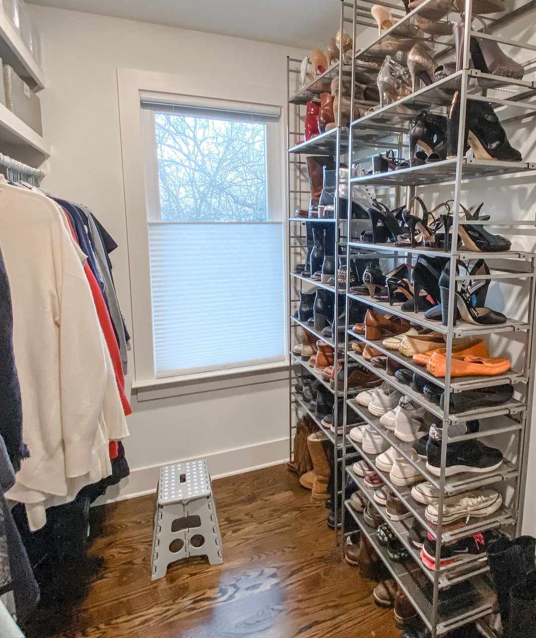 A closet with a large shoe rack