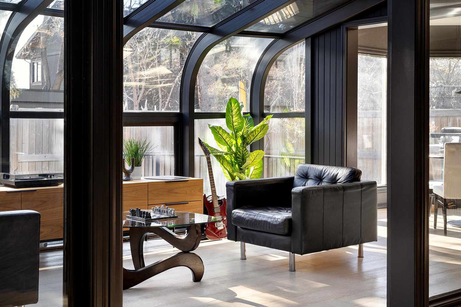 living room with leather furniture and wood accents