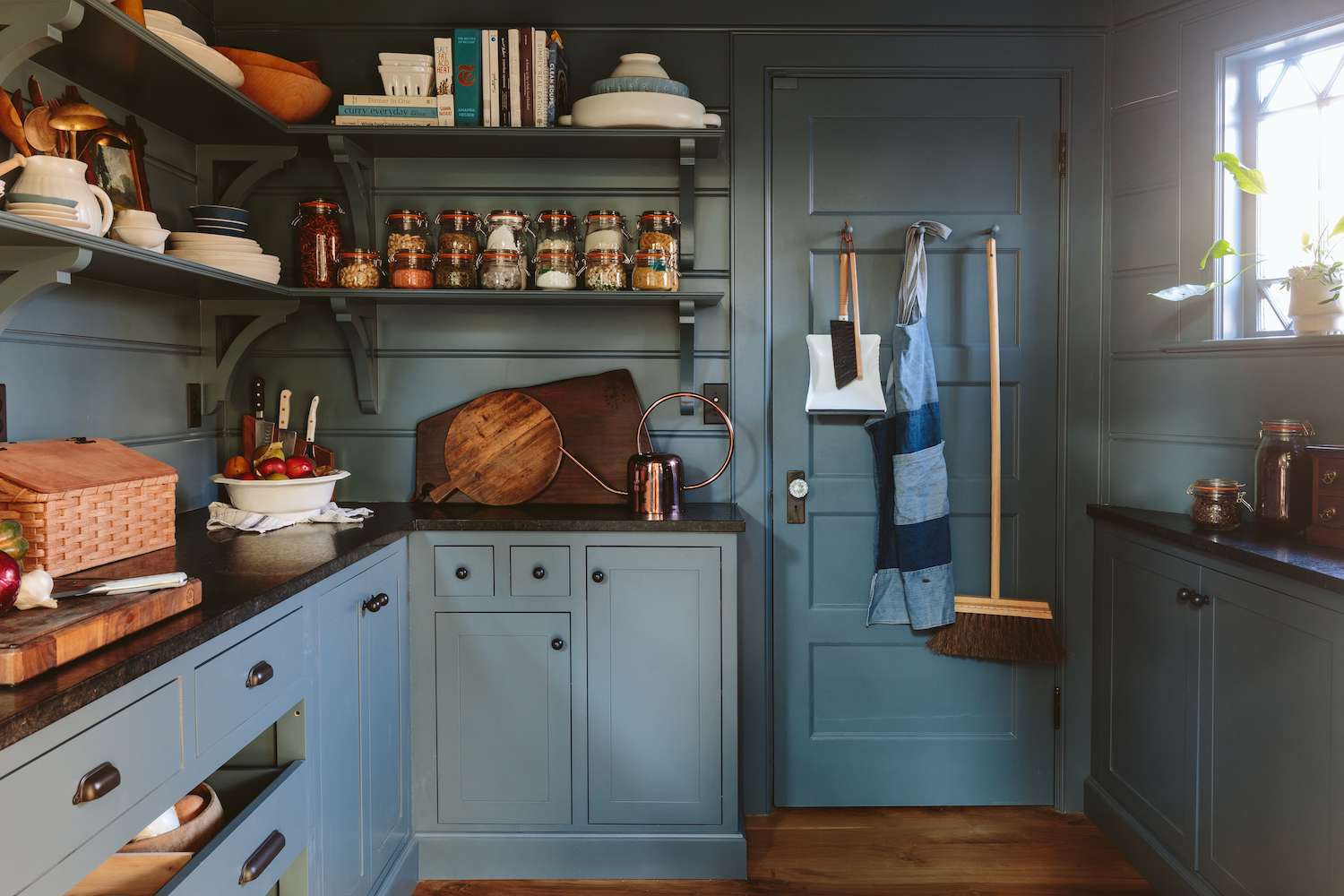 farmhouse kitchen pantry with blue cabinets