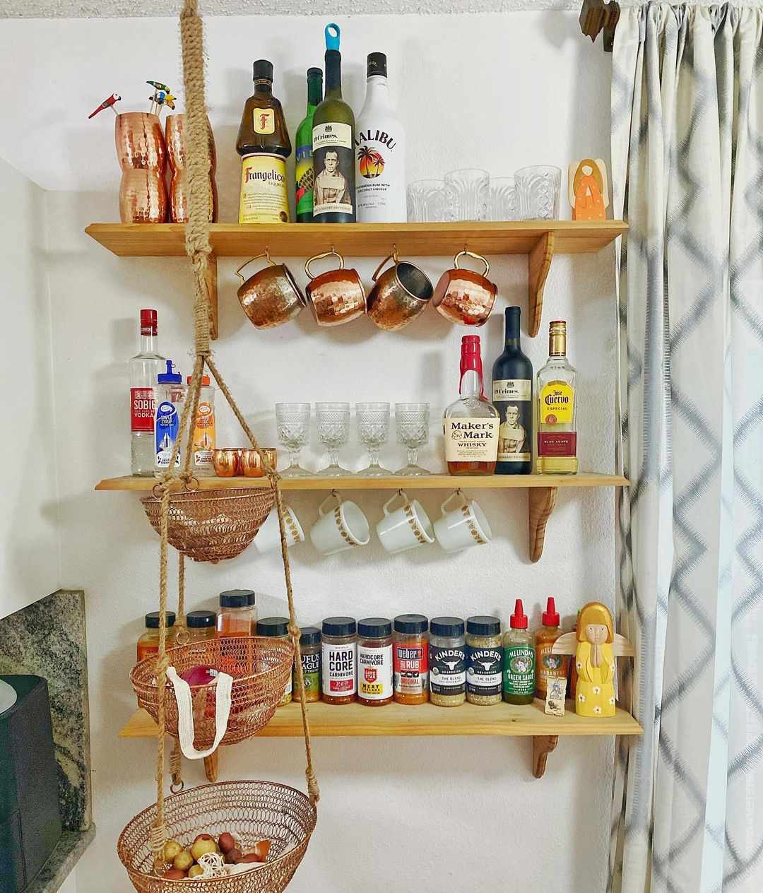 open kitchen shelving with bar supplies