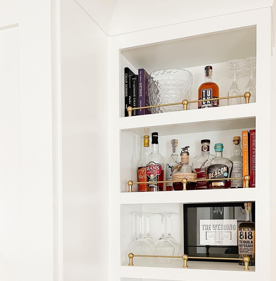 built in shelves with brass