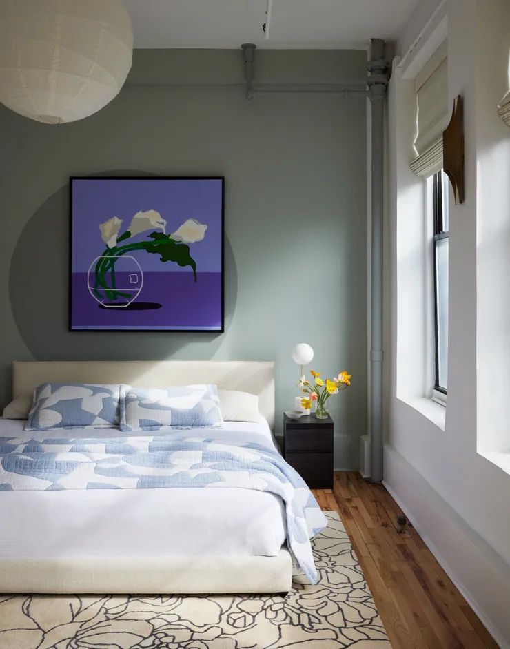 colorful wall art over the bed