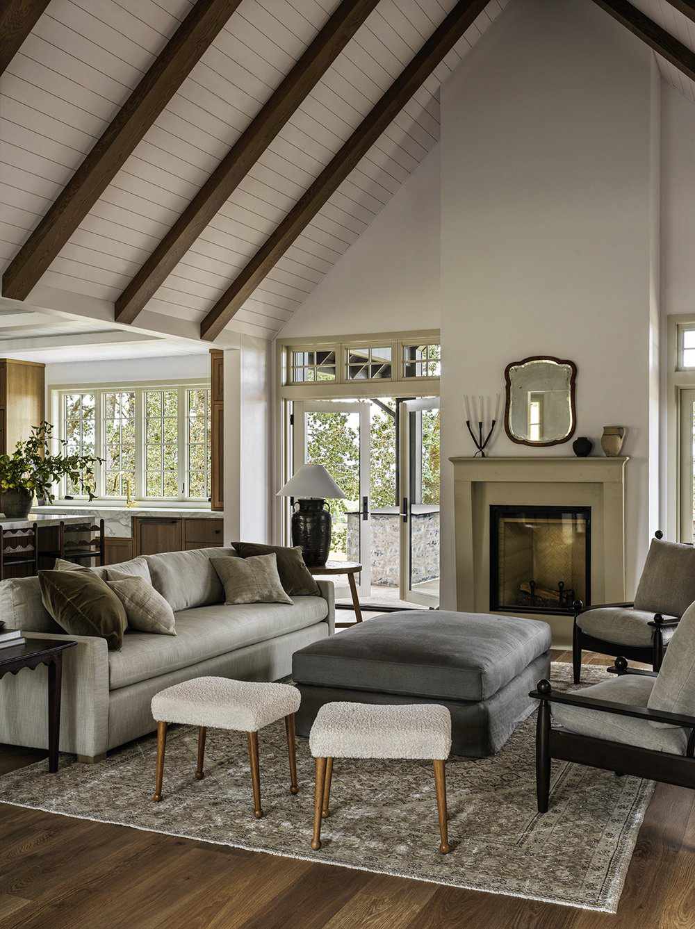 Living room with vaulted ceiling with kitchen on the left