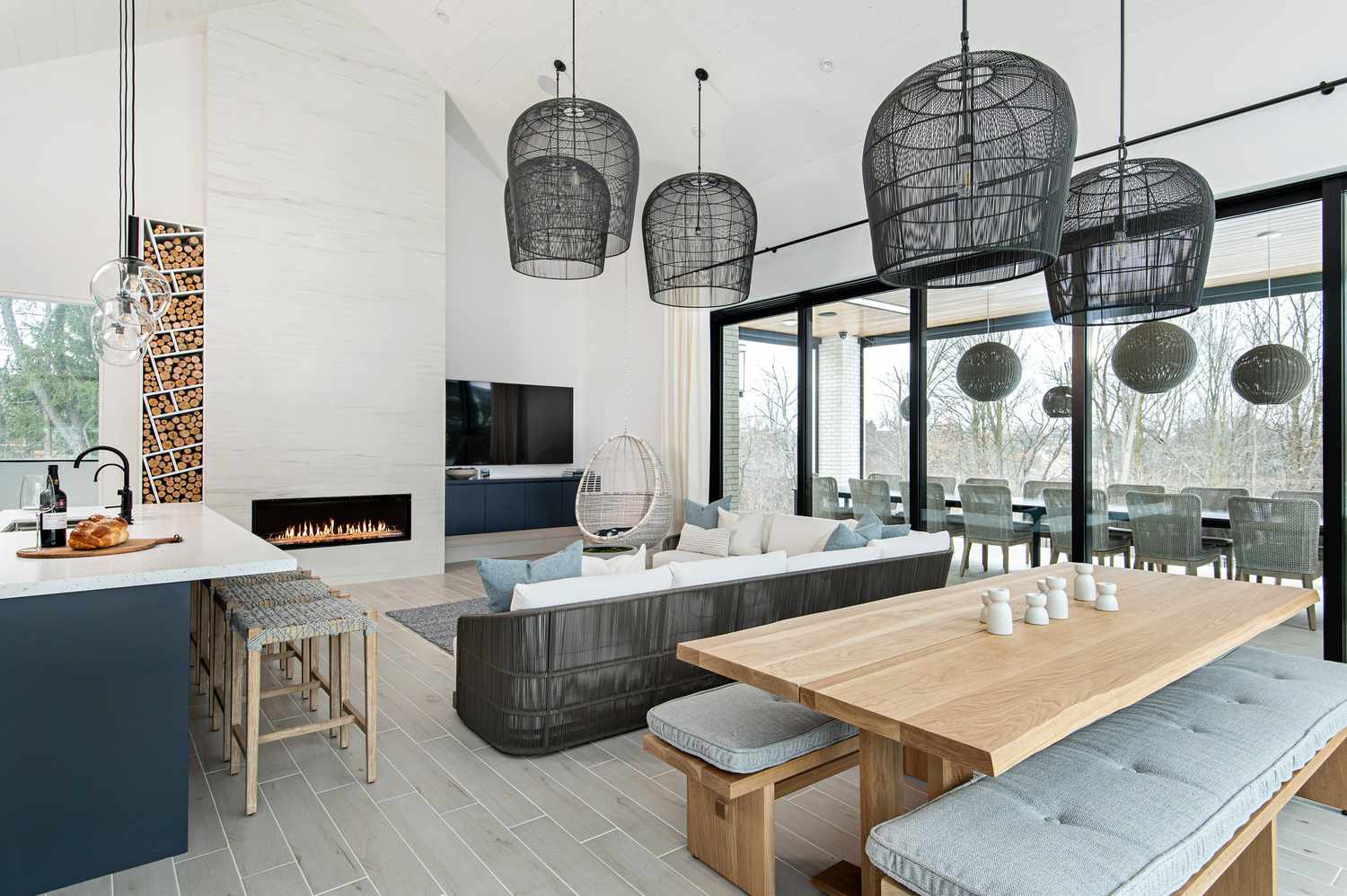 Open kitchen, living and dining room with oversized ceiling pendant lights