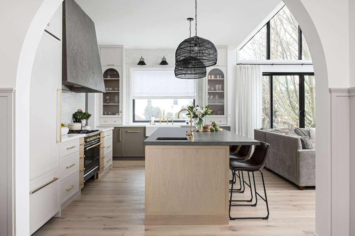 Kitchen with wood island and open living room on the right