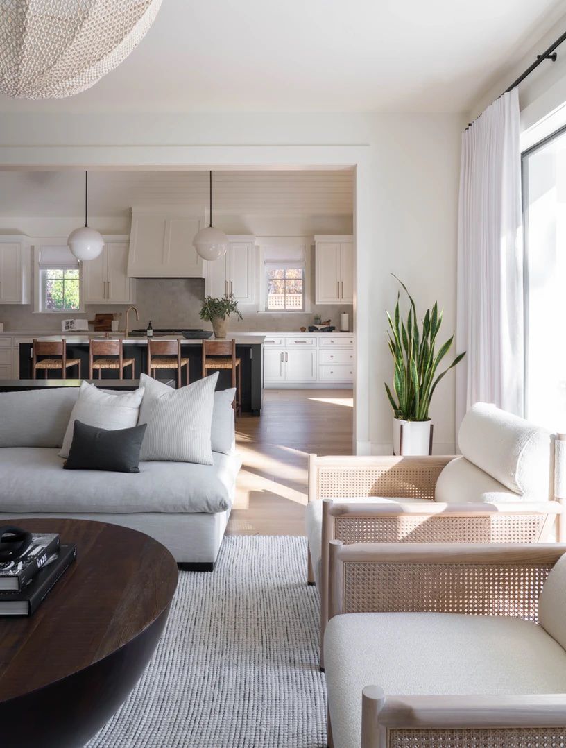 Modern living room with the kitchen in the background