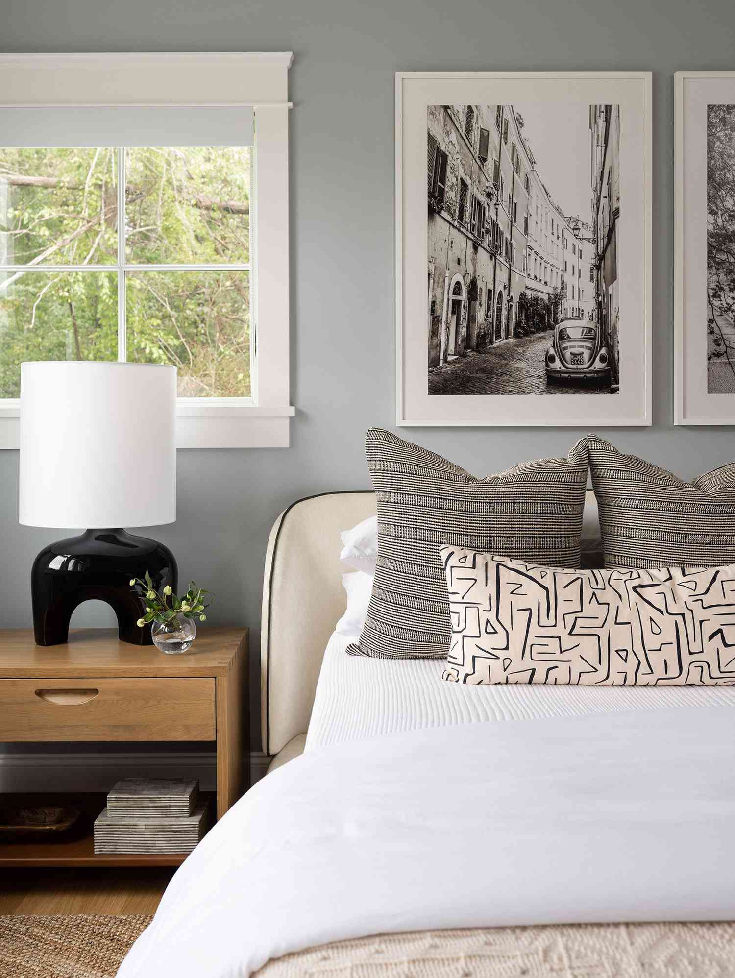 decorating with black-and-white photos over the bed