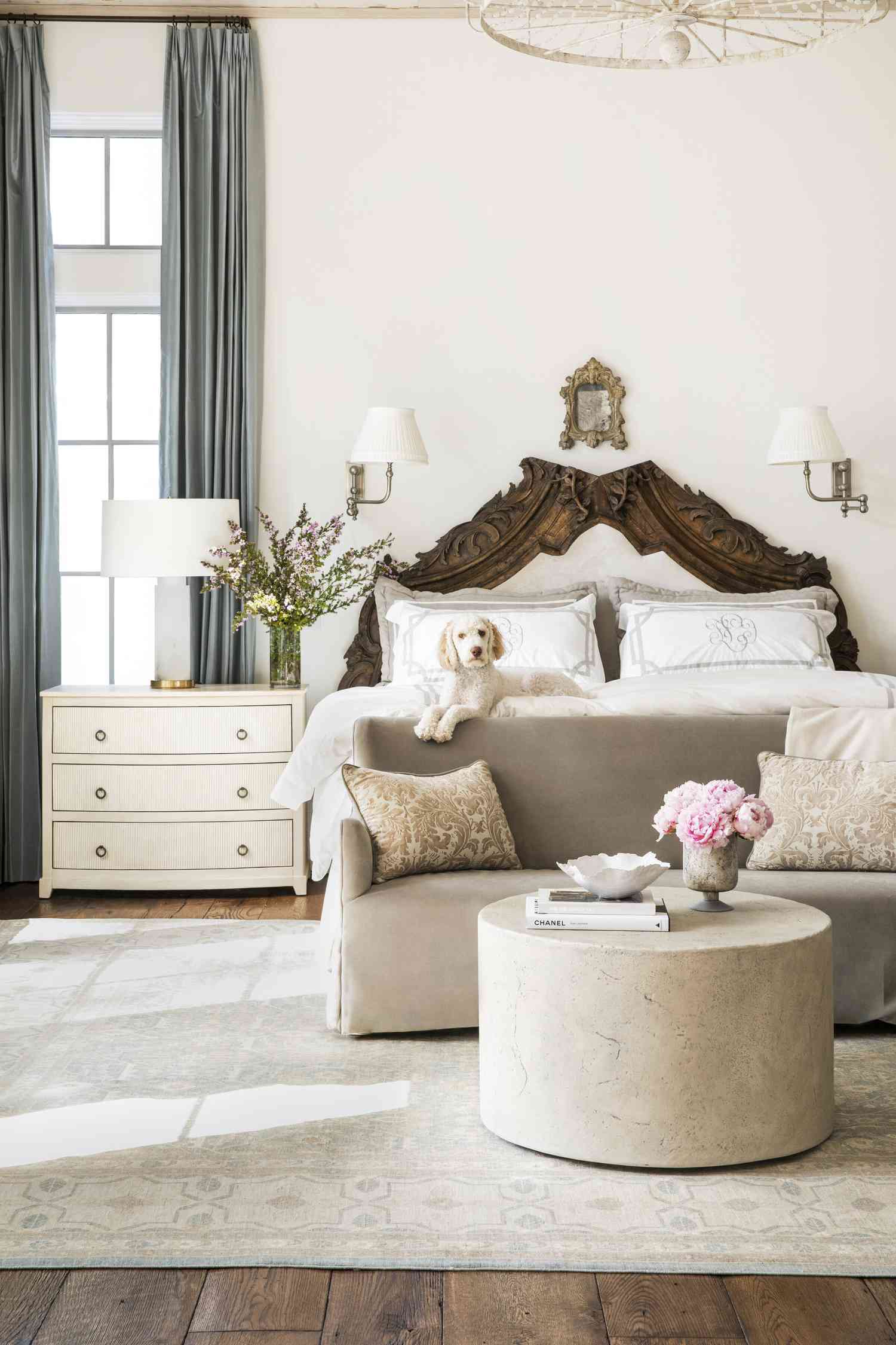 decorating with a small antique mirror over the bed