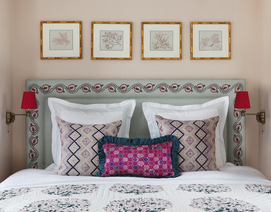 decorating with a row of botanical prints over the bed