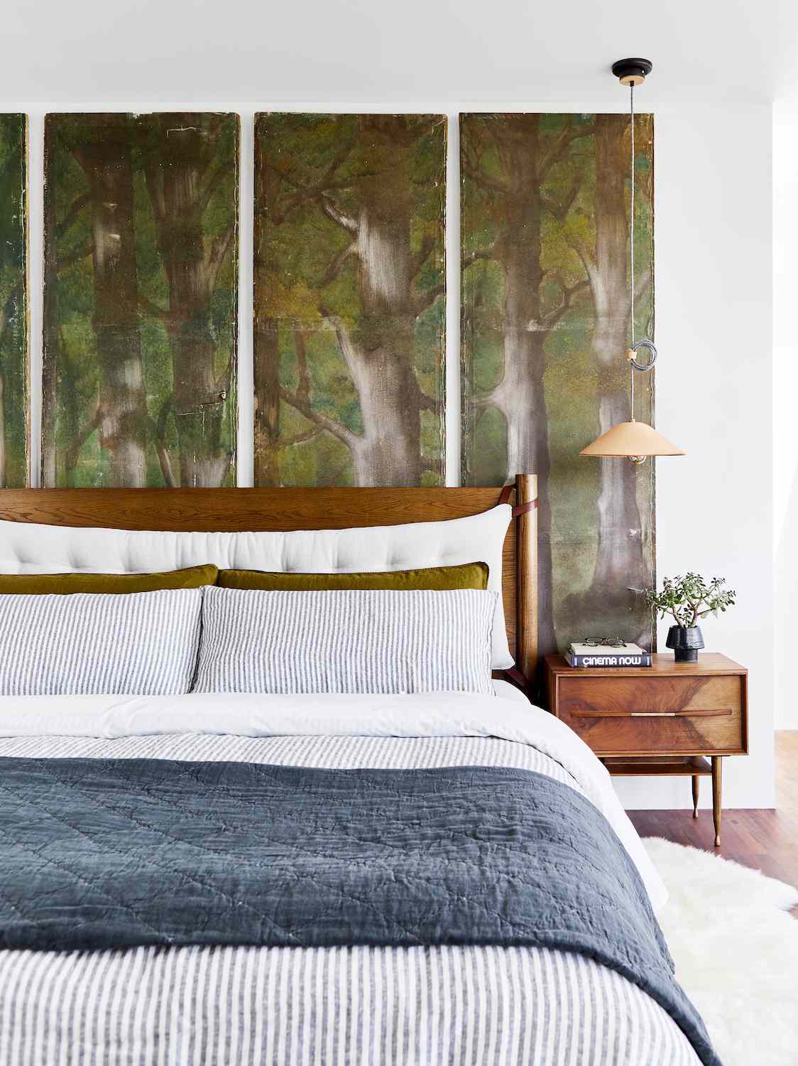 tree mural behind bed