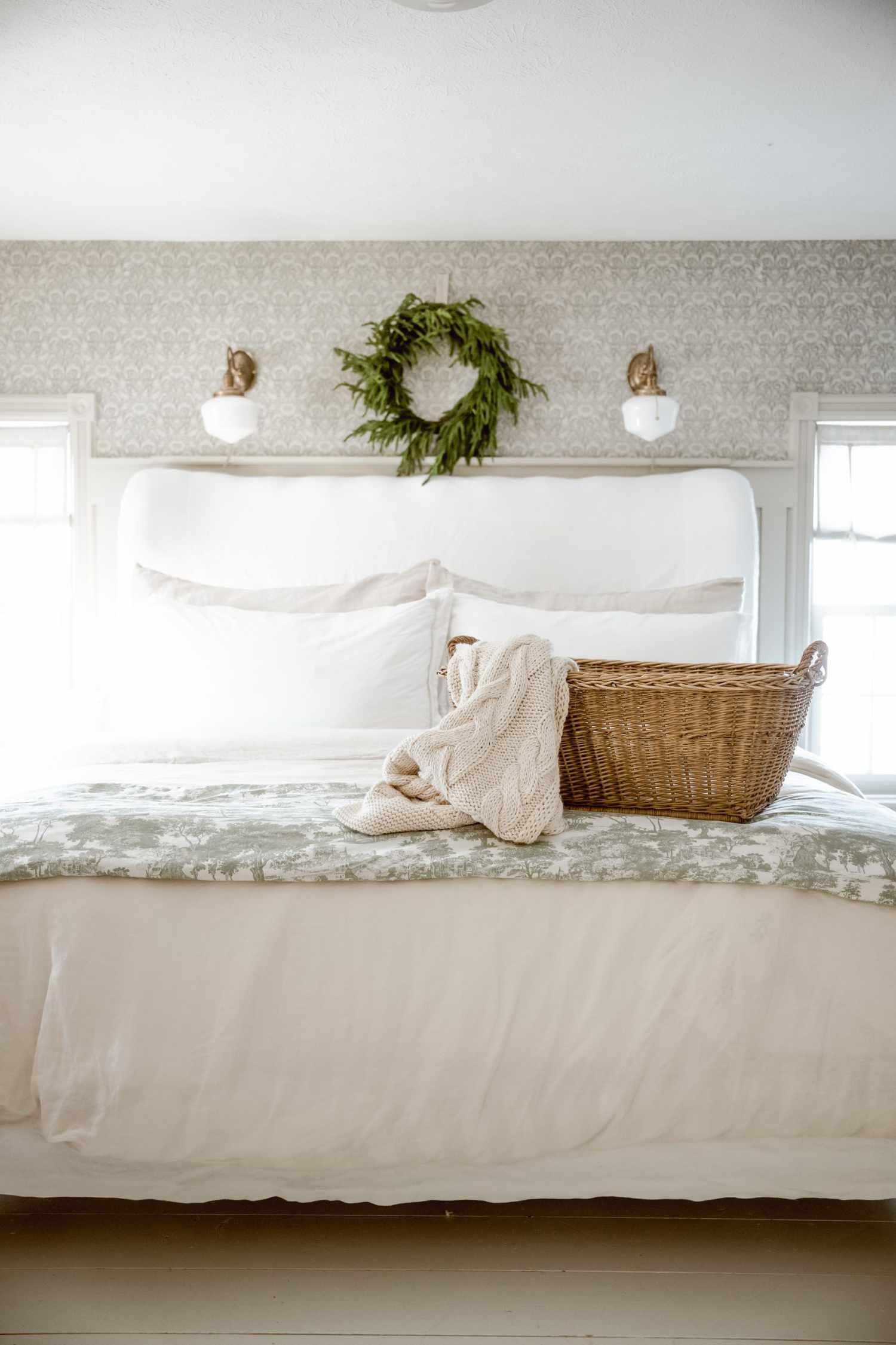 seasonal wreath over bed