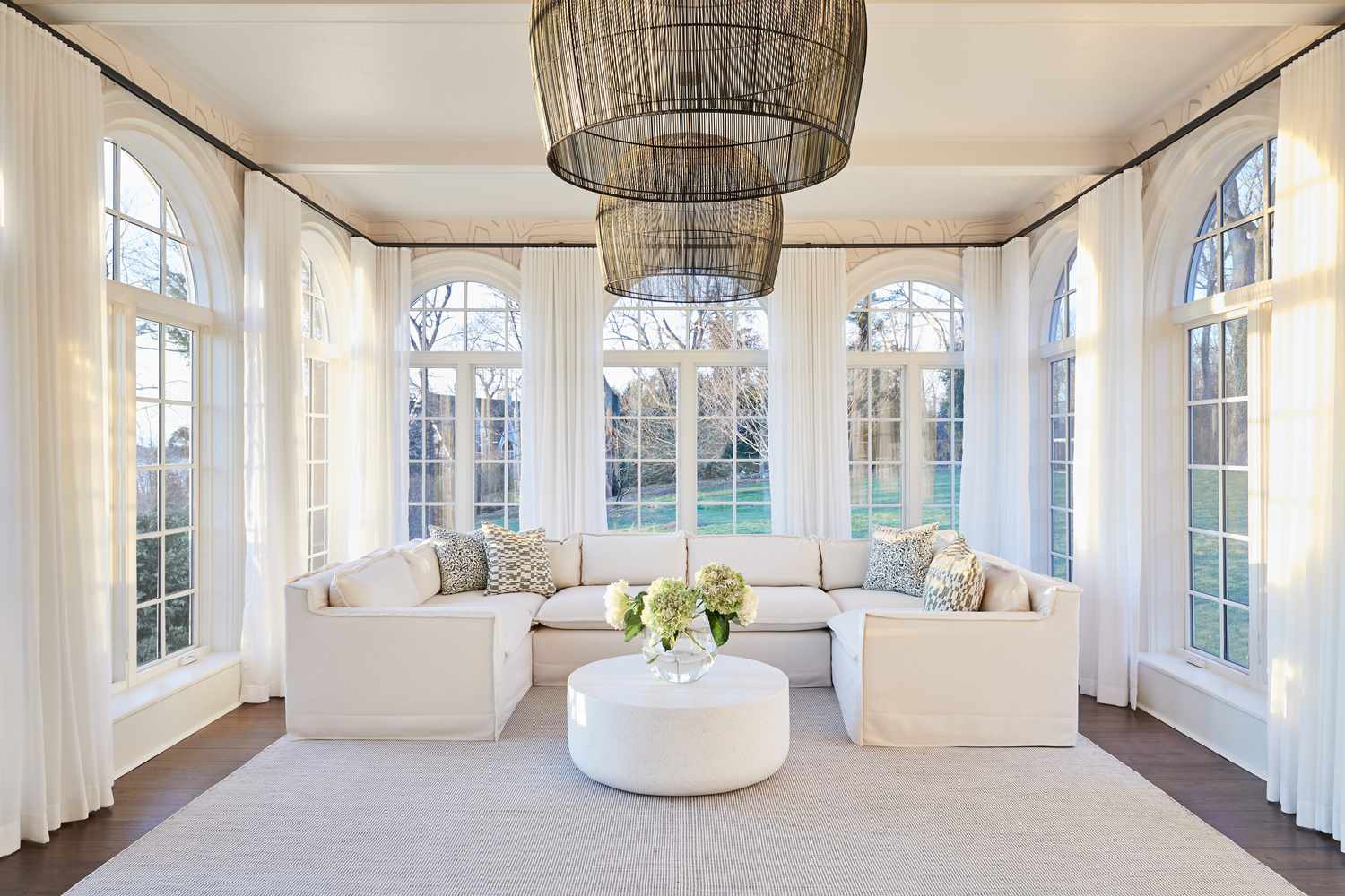 sunroom with arched windows