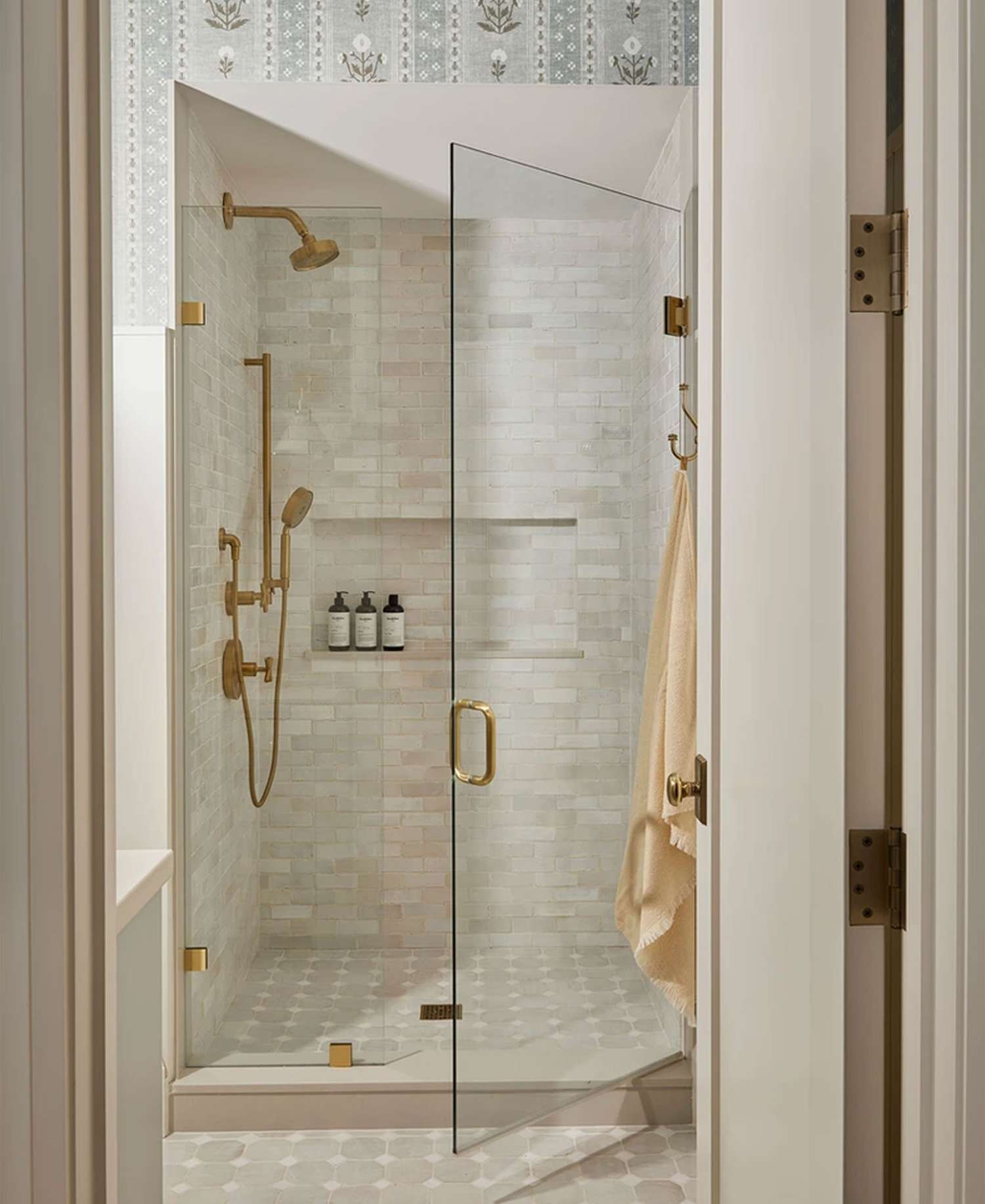 Ashley Montgomery Design bathroom with unframed glass door shower.