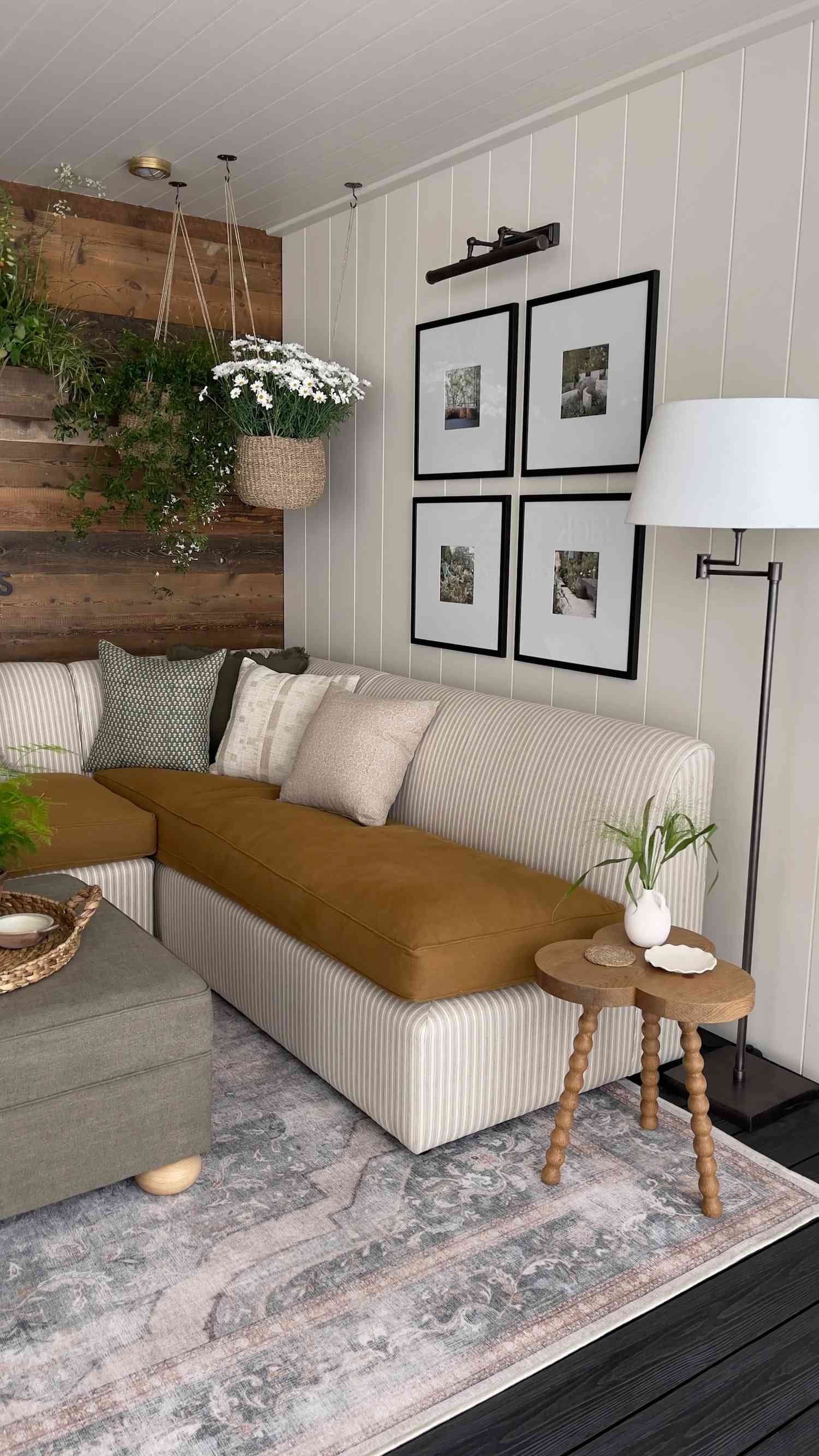 Sunroom with white shiplap walls and a wood accent wall